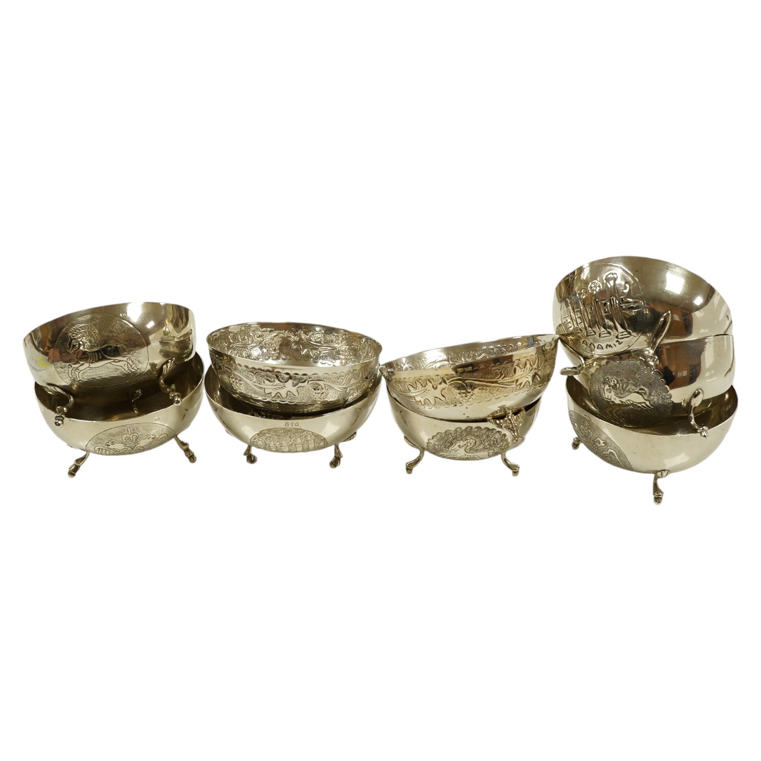 A set of nine Greek white metal footed bowls, stamped silver 830, 21.5 oz. Condition - good